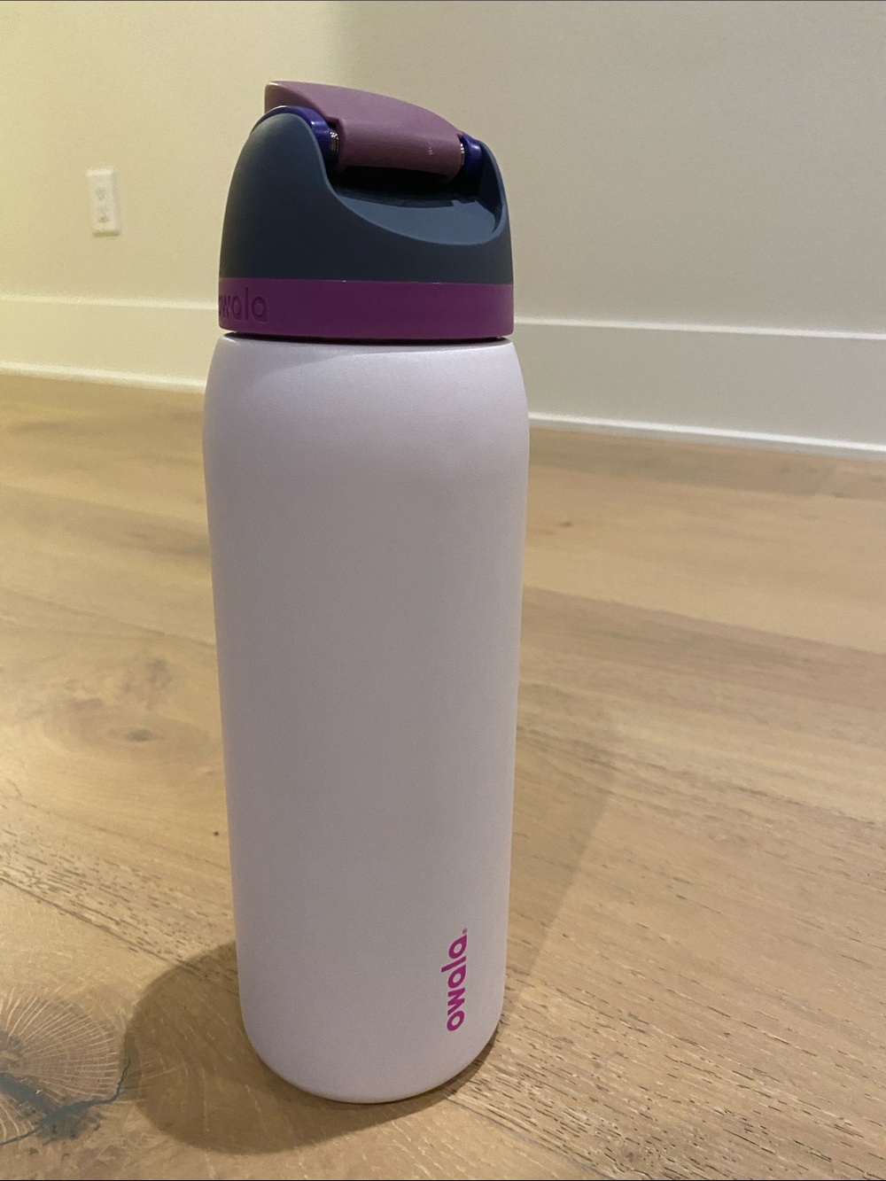 Owala Insulated Water Bottle in Light Pink with Purple Accents 40oz